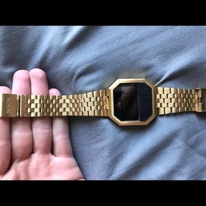 Gold Nixon watch.
